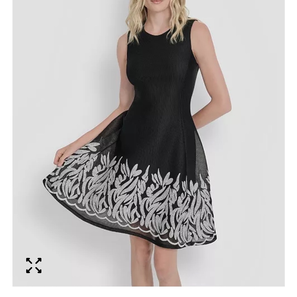 DKNYC Black Beautiful Dress with Silver Embroidery. Flows from body slims wearet